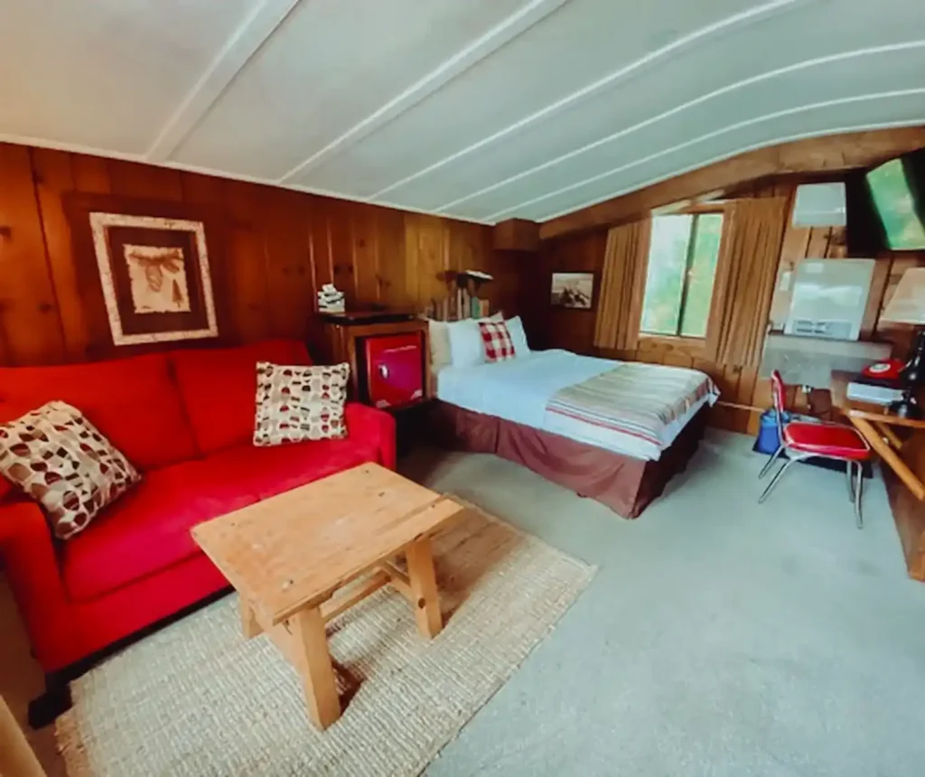 Cozy King Bed with Red couch