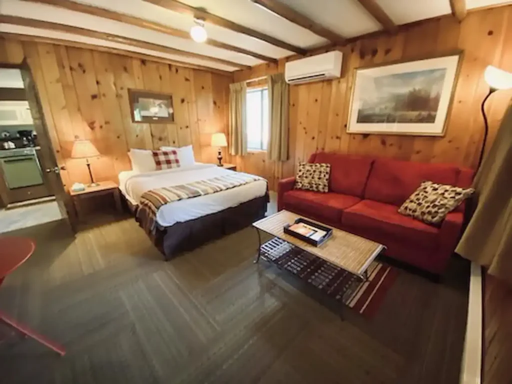 Cozy King Bed room with red couch